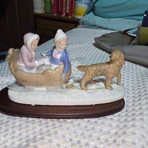 MEICO INC FIGURINE COLLECTIBLE PORCELAIN BOY AND DOG PULLING SLED